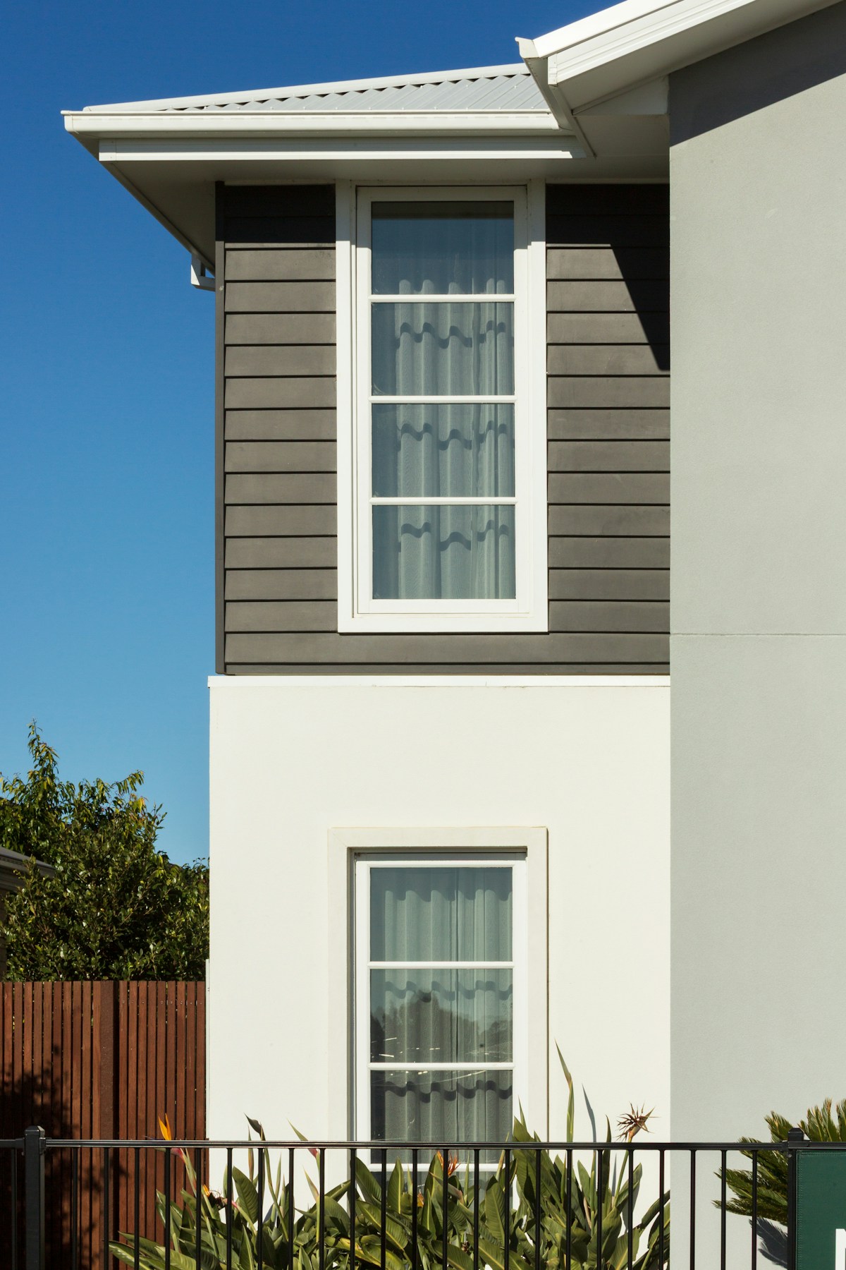 Contemporary home exterior with tall windows